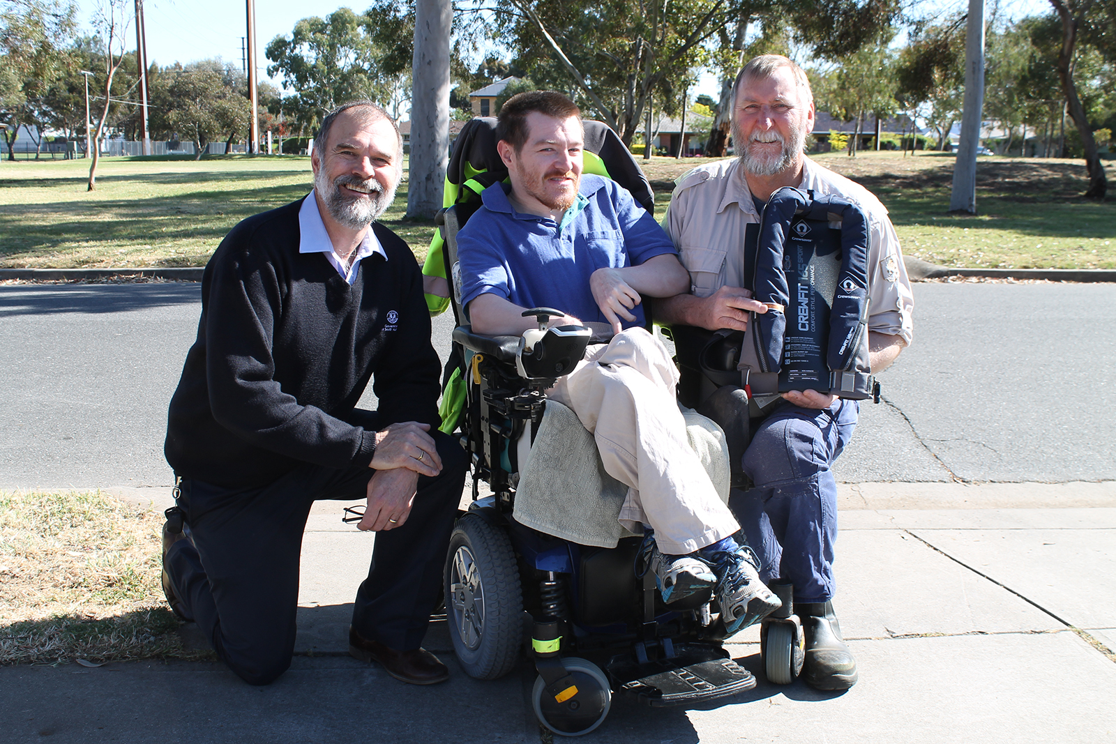 Photo of Trevor and Chris receiving their prize from DPTI's Phil Moffatt