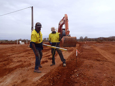 Another photo of two men working on a new road