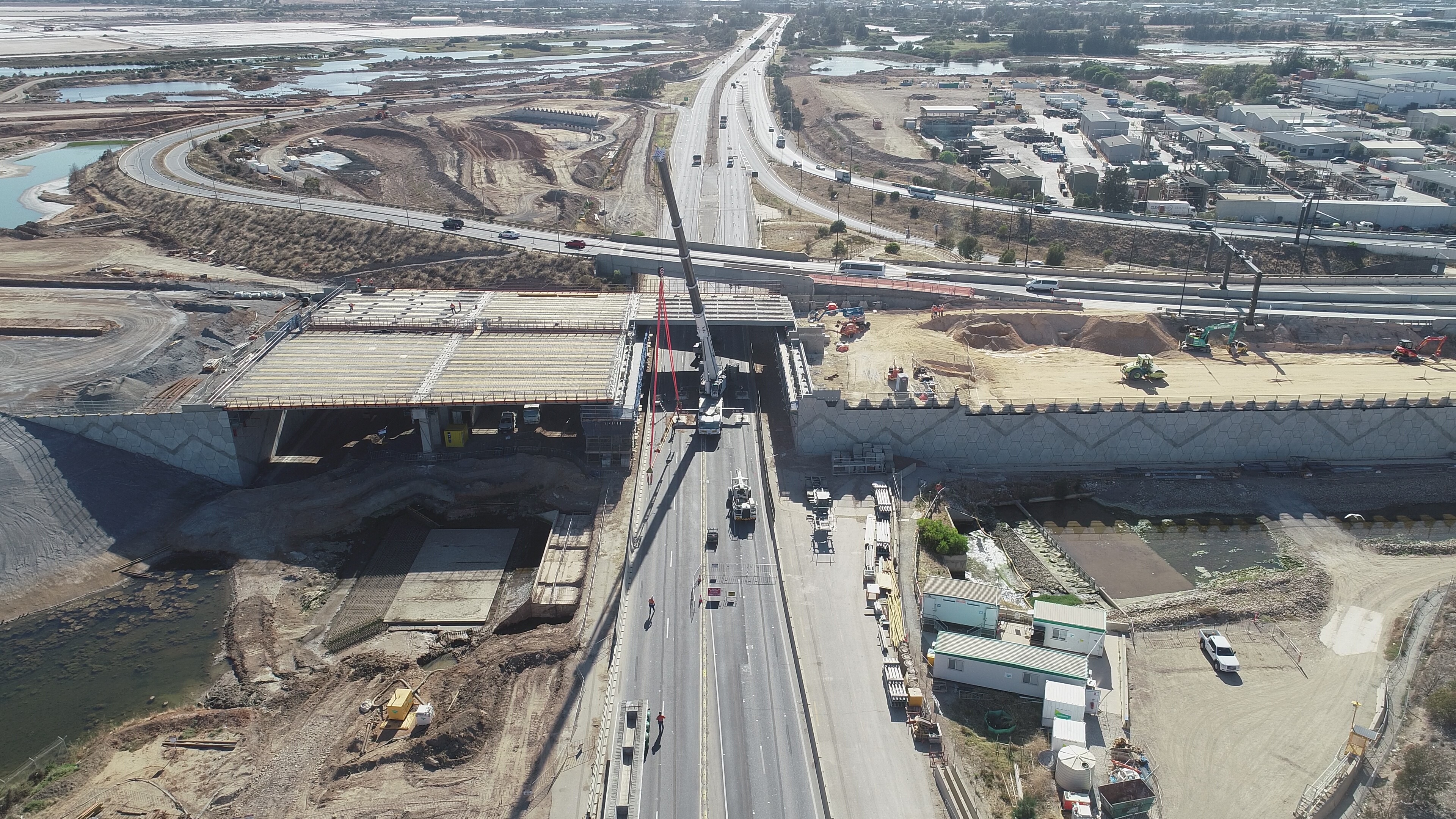 400 tonne crane placing 40-tonne bridge beams in position over the Port River Expressway (looking east) - January 2019