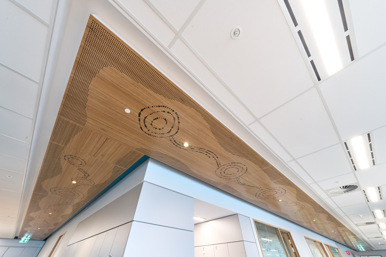 Artwork along ceiling representing Seven Sisters Songline and Tjukurpa.