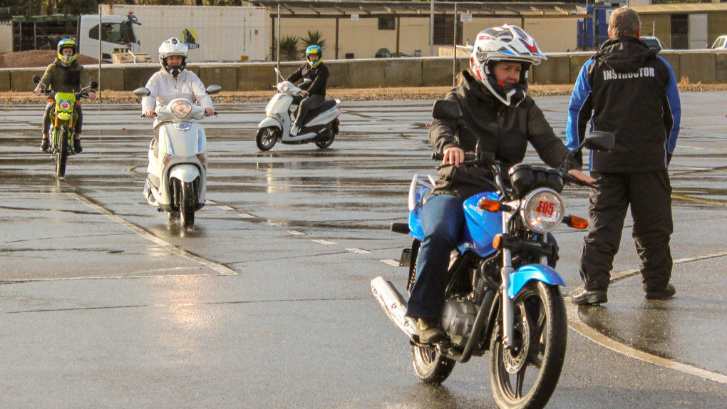 Students learn how to ride a motorbike